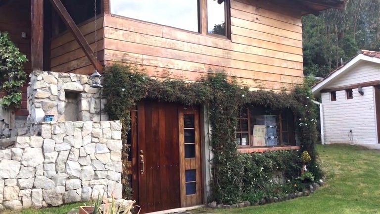 The same guest house afterwards, on a new stone foundation with a door into the bodega beneath