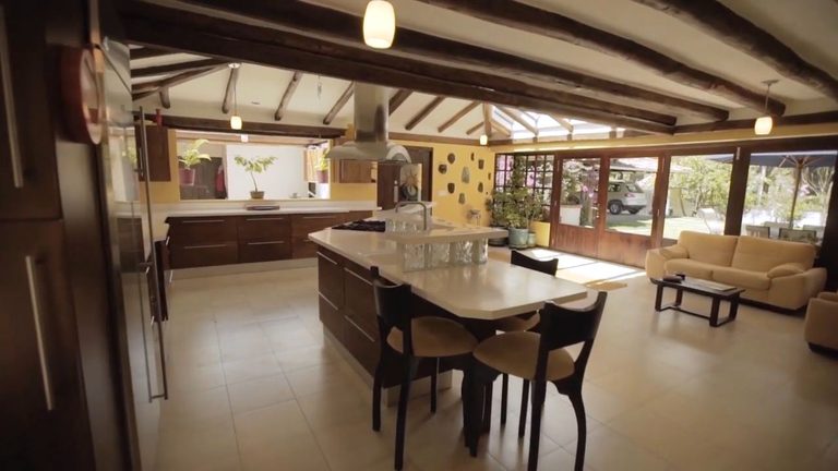 The kitchen after renovation, opened into the dining and living great room