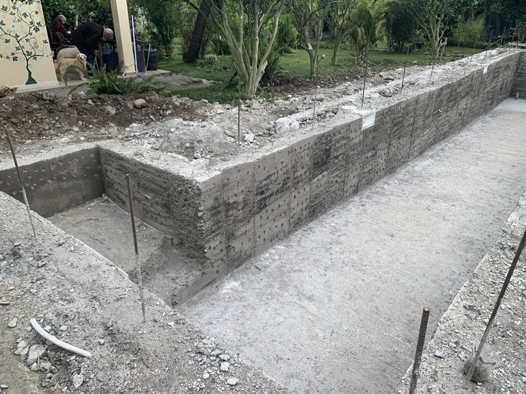 The poured reinforced concrete shell of the lap pool before tiling
