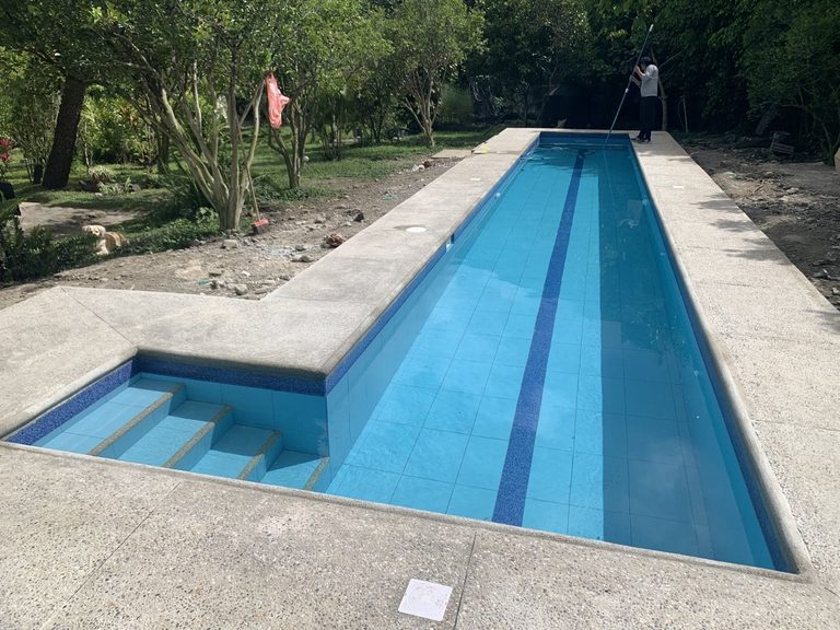 The finished 14-meter lap pool, tiled and filled